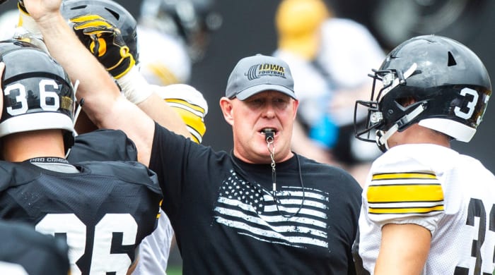 Chris Doyle huddles up with players during a Hawkeyes football Kids Day scrimmage, Saturday, Aug. 10, 2019, at Kinnick Stadium.